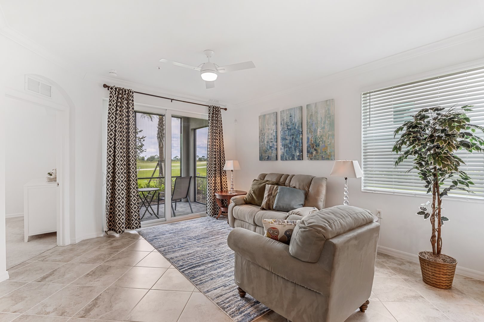 Living Room w/ Golf Course & Lake Views